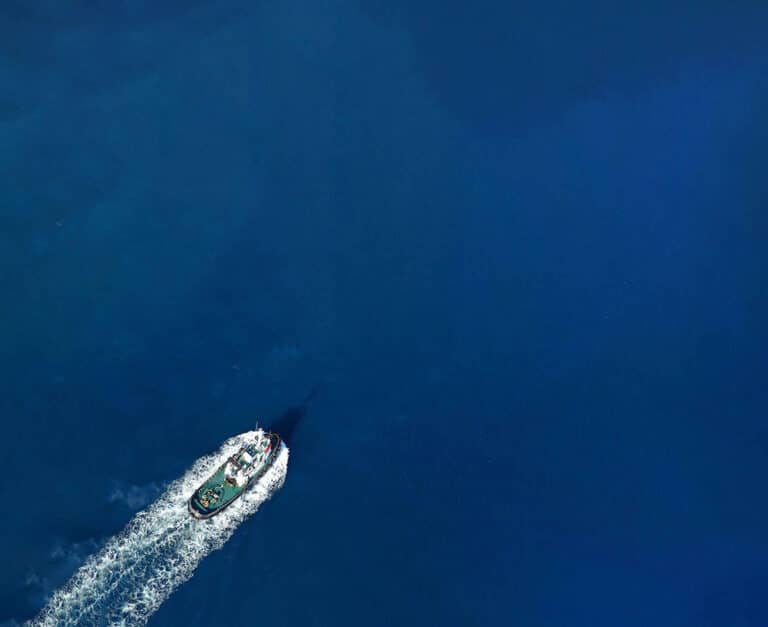 An overview of a maritime vessel sailing calm seas