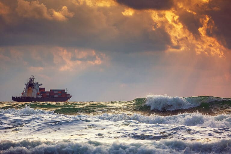Cargo ship at sea on a cluday day
