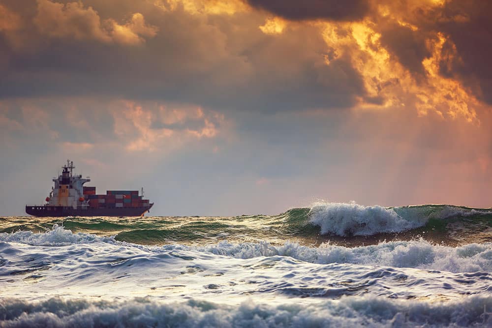 Cargo ship at sea on a cluday day