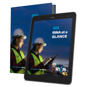 A mockup of a book and a tablet with RINA brochure RINA at a glance 2024 on the cover