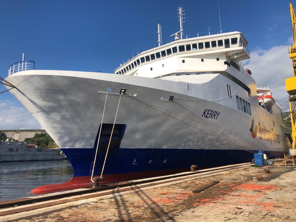 A close-up the bow of Brittany Ferries passenger vessel anchored to a harbour