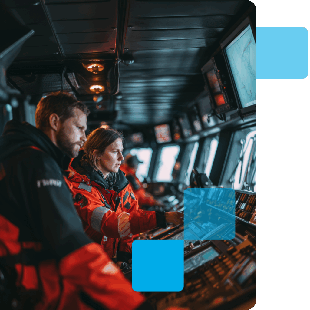 Dos oficiales en el puente de un barco supervisando los sistemas de navegación y control.